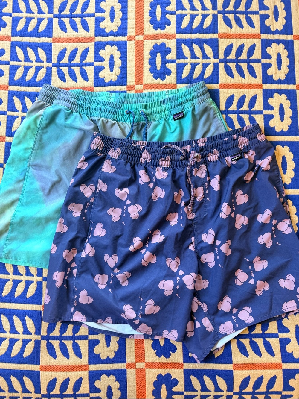 Patagonia Navy Board Shorts with Pink Floral Print, Green marble print.